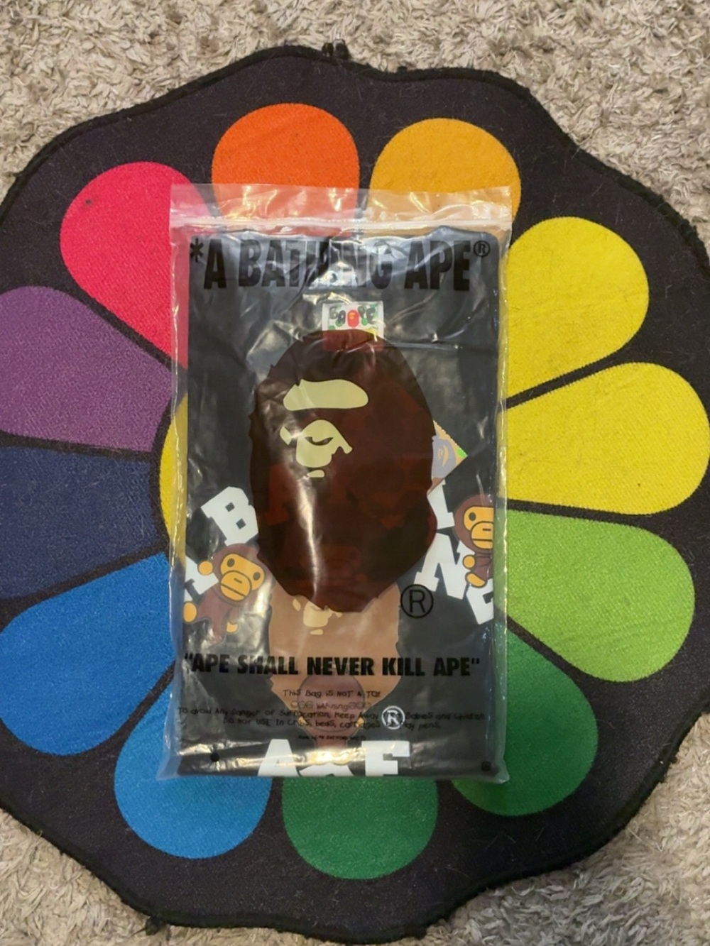 A Bathing Ape Black Graphic Tee with Brown Ape Logo